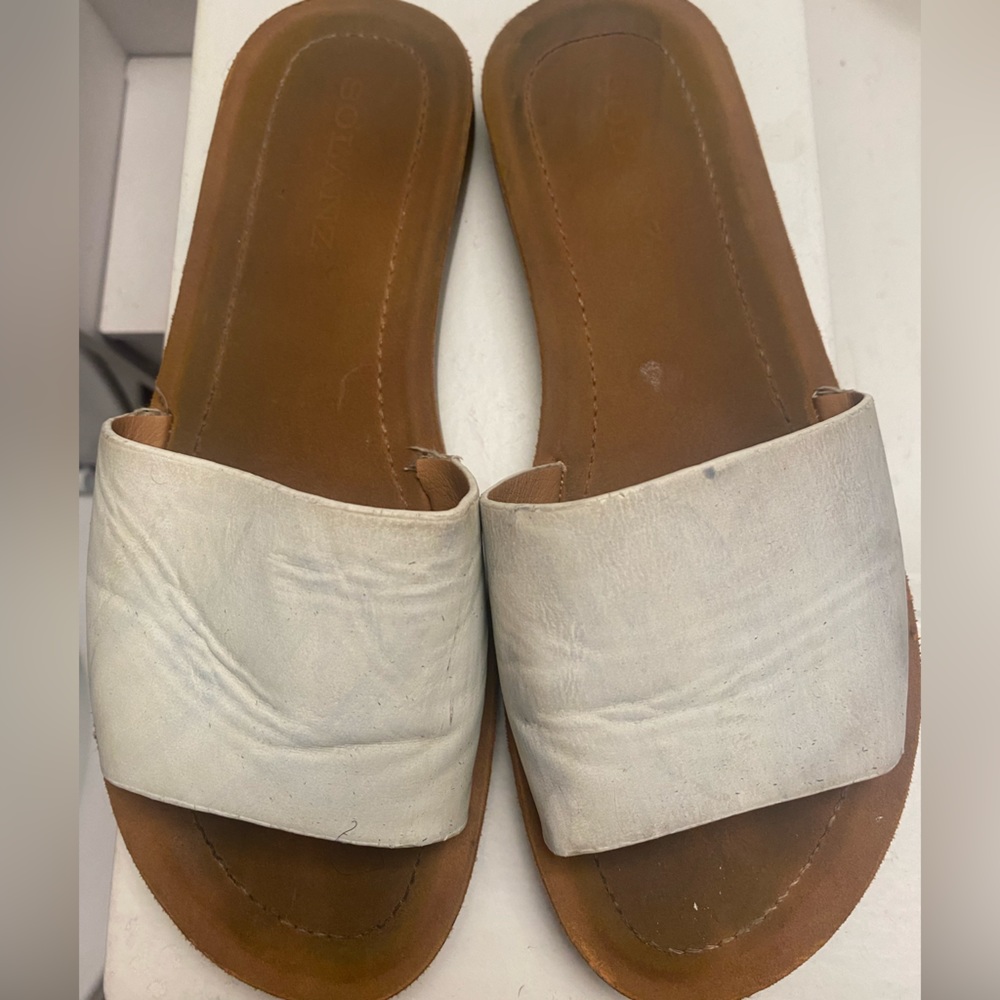 Well worn leather flats